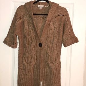 Short sleeve hooded cable knit sweater.